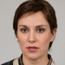 Neutral white young-adult female with medium  brown hair and brown eyes