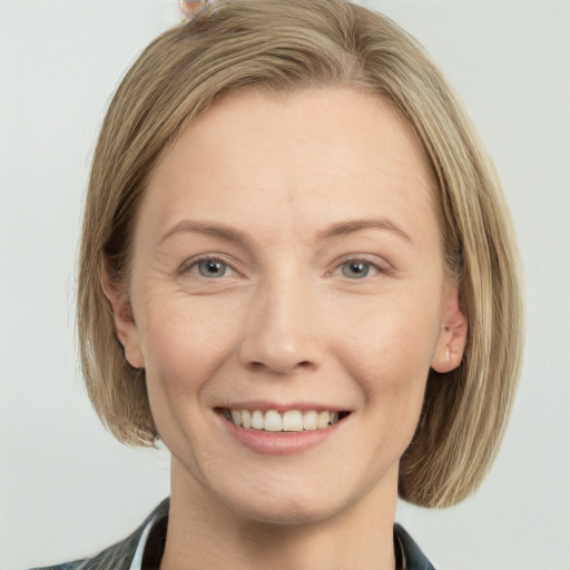 Joyful white young-adult female with medium  brown hair and blue eyes