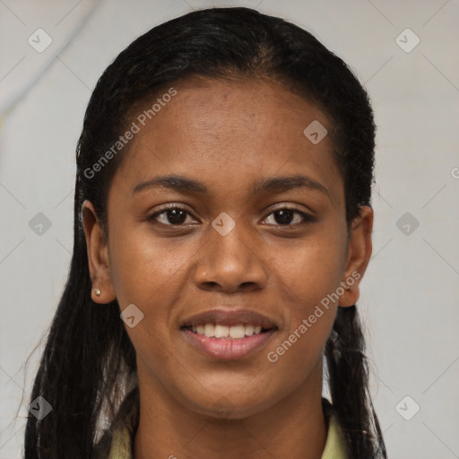 Joyful black young-adult female with long  brown hair and brown eyes