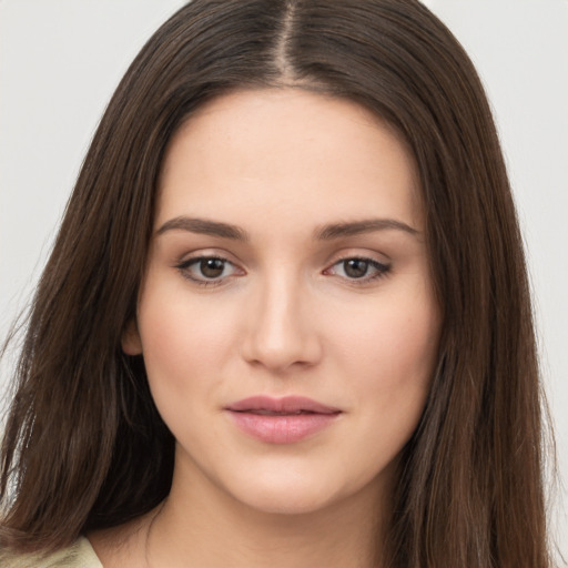 Neutral white young-adult female with long  brown hair and brown eyes