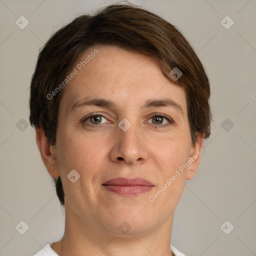 Joyful white adult female with short  brown hair and grey eyes