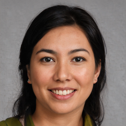 Joyful white young-adult female with long  black hair and brown eyes