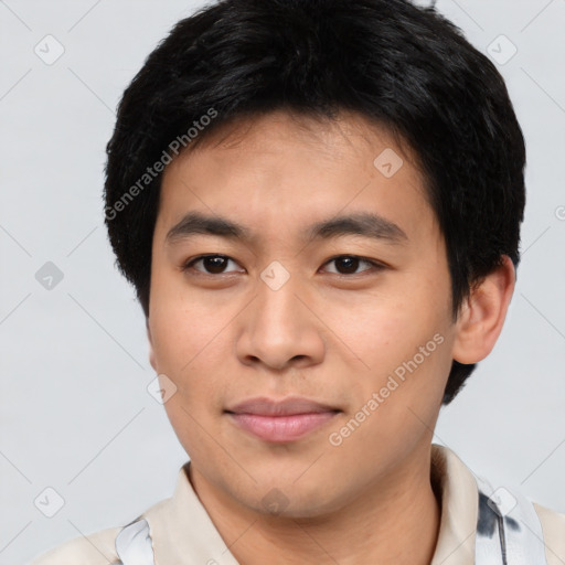 Joyful asian young-adult male with short  brown hair and brown eyes