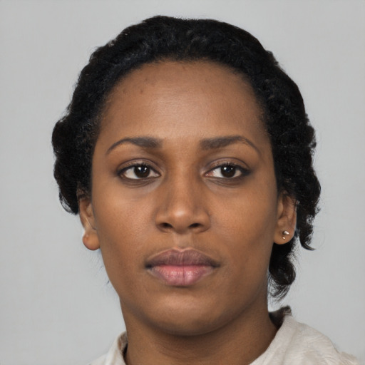 Neutral black young-adult female with short  black hair and brown eyes