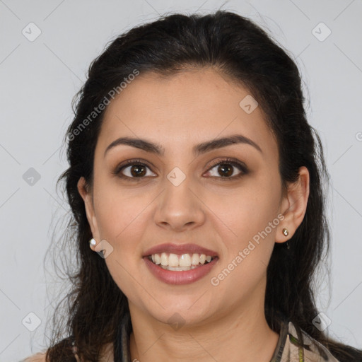 Joyful latino young-adult female with long  brown hair and brown eyes