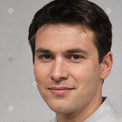 Joyful white young-adult male with short  brown hair and brown eyes