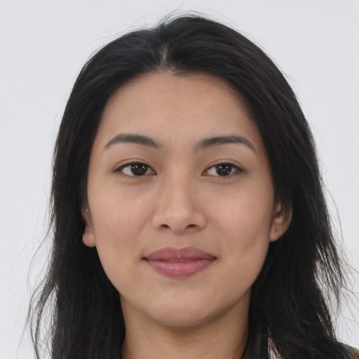 Joyful asian young-adult female with long  black hair and brown eyes