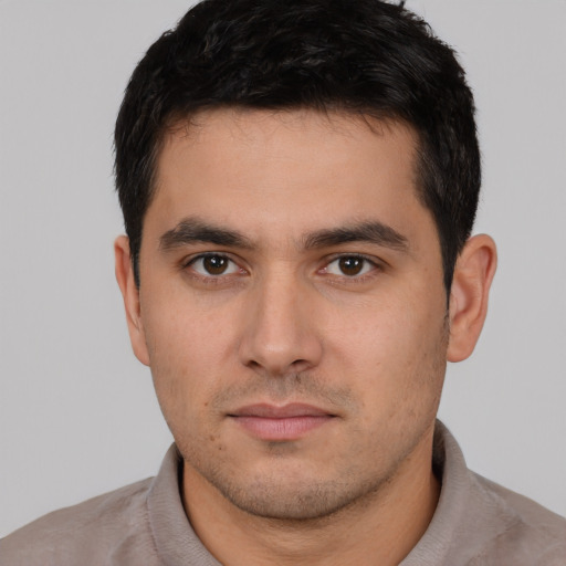 Neutral white young-adult male with short  black hair and brown eyes