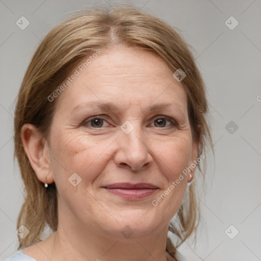 Joyful white adult female with medium  brown hair and brown eyes