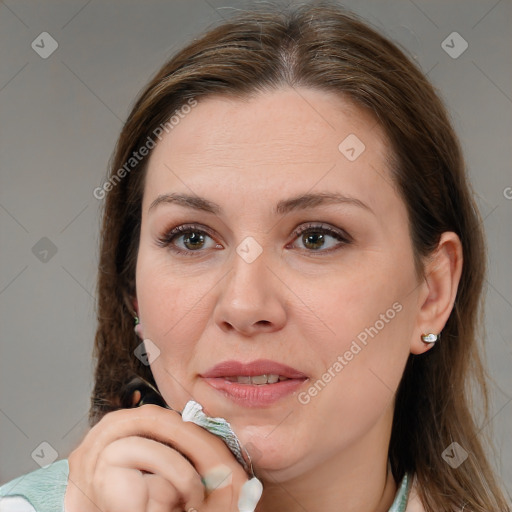 Joyful white adult female with medium  brown hair and brown eyes