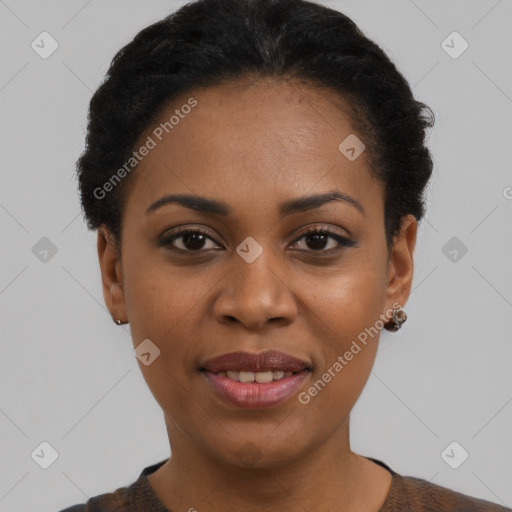 Joyful black young-adult female with short  black hair and brown eyes