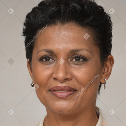 Joyful black adult female with short  brown hair and brown eyes