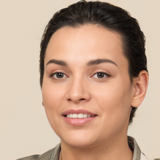 Joyful white young-adult female with medium  brown hair and brown eyes