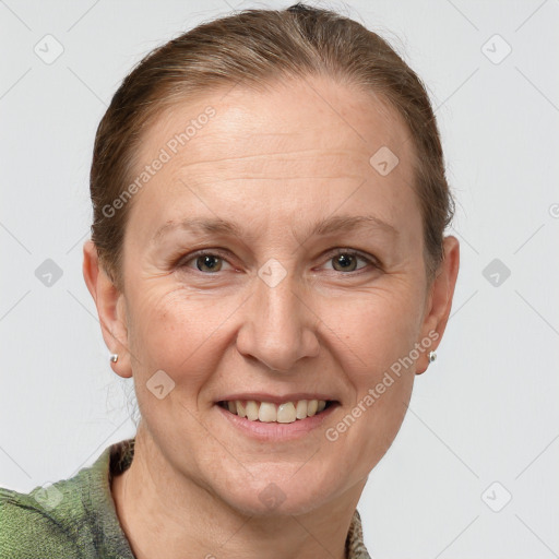 Joyful white adult female with short  brown hair and grey eyes