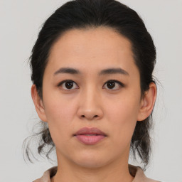 Neutral asian young-adult female with medium  brown hair and brown eyes