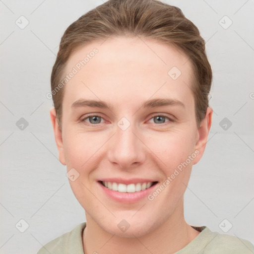 Joyful white young-adult female with short  brown hair and grey eyes