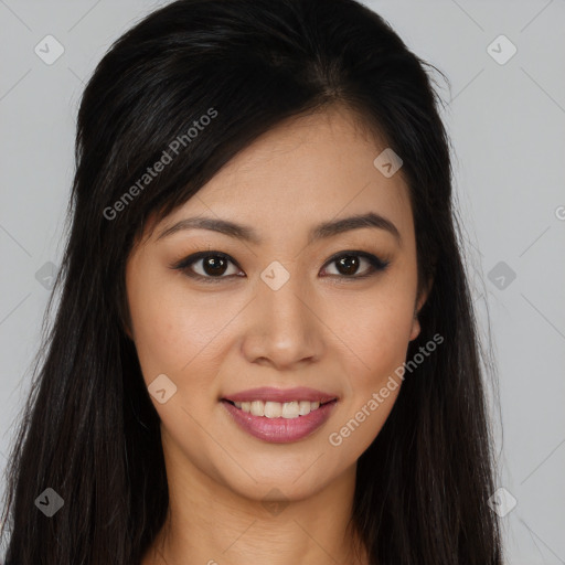 Joyful asian young-adult female with long  brown hair and brown eyes