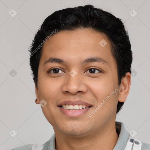 Joyful latino young-adult male with short  brown hair and brown eyes