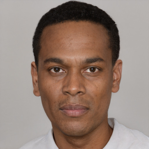 Neutral black young-adult male with short  black hair and brown eyes