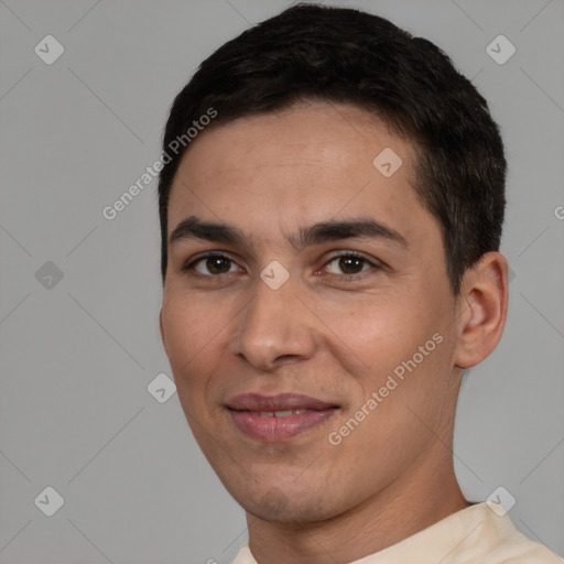 Joyful white young-adult male with short  black hair and brown eyes