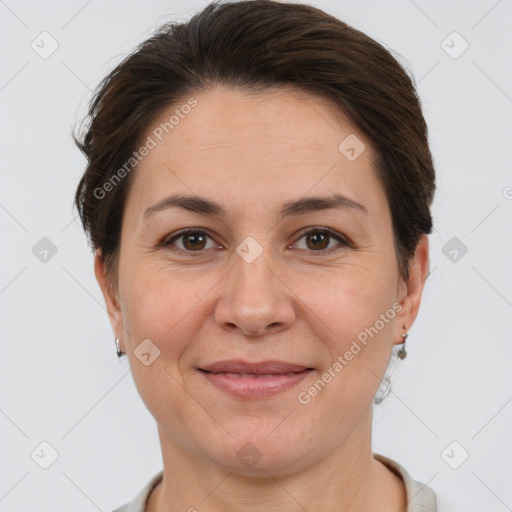 Joyful white adult female with short  brown hair and brown eyes