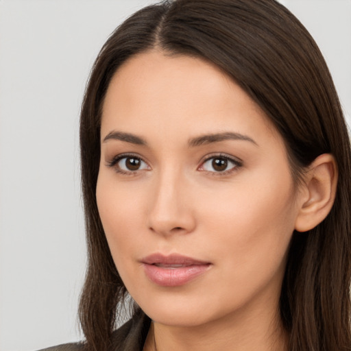 Neutral white young-adult female with long  brown hair and brown eyes