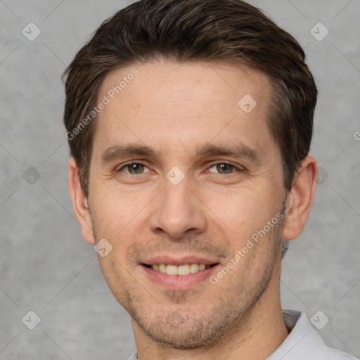 Joyful white adult male with short  brown hair and brown eyes