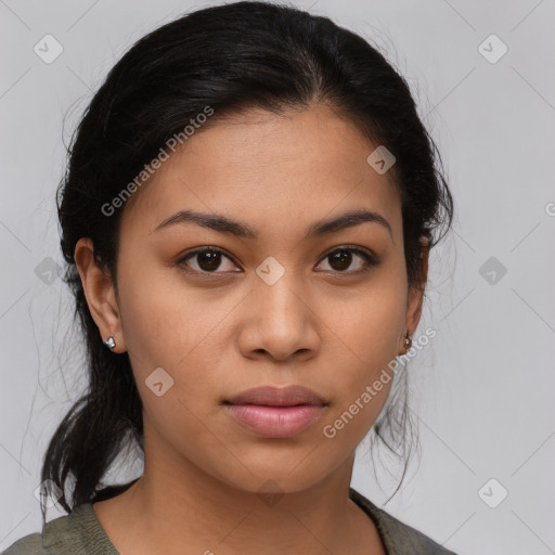 Joyful latino young-adult female with medium  brown hair and brown eyes