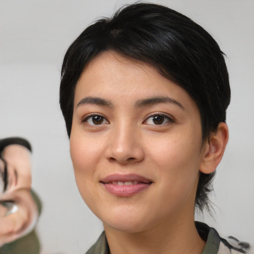 Joyful asian young-adult female with medium  brown hair and brown eyes
