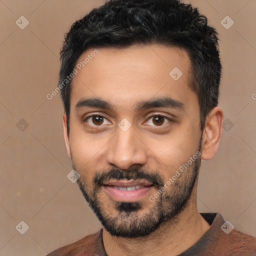 Joyful latino young-adult male with short  black hair and brown eyes