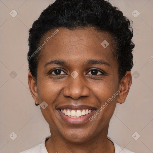 Joyful black young-adult female with short  black hair and brown eyes