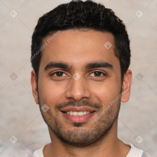 Joyful latino young-adult male with short  black hair and brown eyes