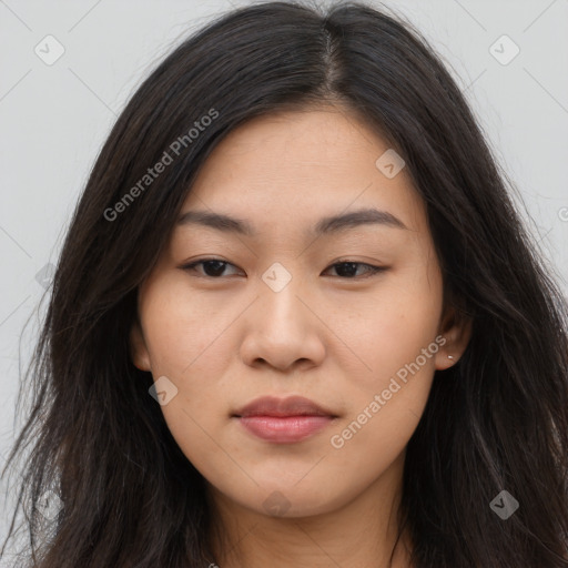 Joyful asian young-adult female with long  brown hair and brown eyes