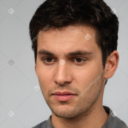 Neutral white young-adult male with short  brown hair and brown eyes