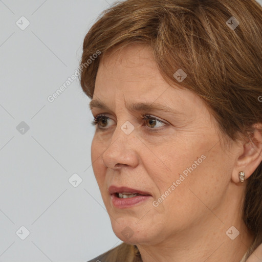 Joyful white adult female with medium  brown hair and brown eyes