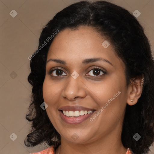 Joyful latino young-adult female with medium  brown hair and brown eyes