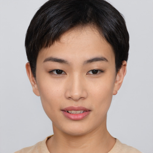 Joyful asian young-adult female with short  brown hair and brown eyes