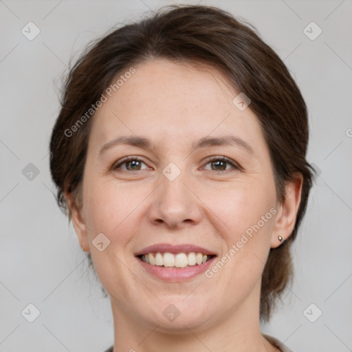 Joyful white adult female with medium  brown hair and grey eyes