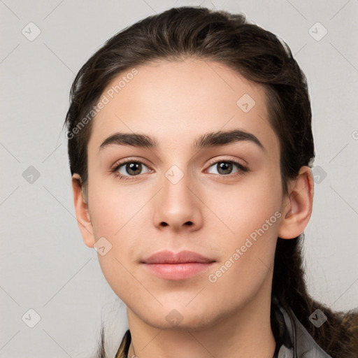 Neutral white young-adult female with long  brown hair and brown eyes