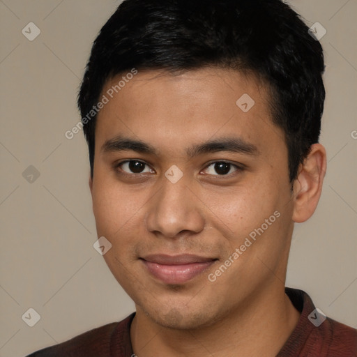 Joyful latino young-adult male with short  brown hair and brown eyes