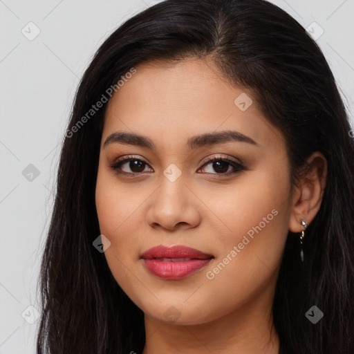 Joyful latino young-adult female with long  brown hair and brown eyes