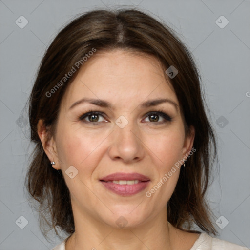 Joyful white adult female with medium  brown hair and grey eyes