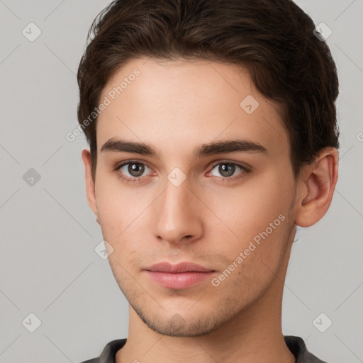 Neutral white young-adult male with short  brown hair and brown eyes