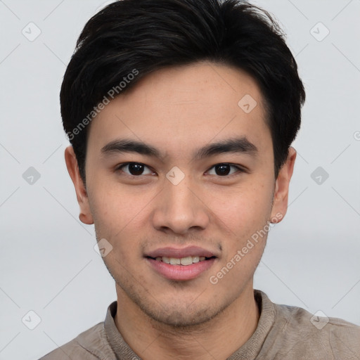 Joyful asian young-adult male with short  black hair and brown eyes