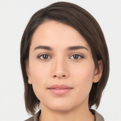 Neutral white young-adult female with medium  brown hair and brown eyes