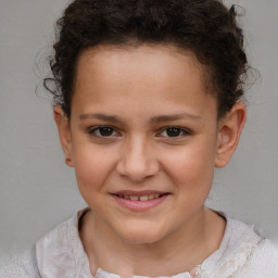 Joyful white child female with short  brown hair and brown eyes