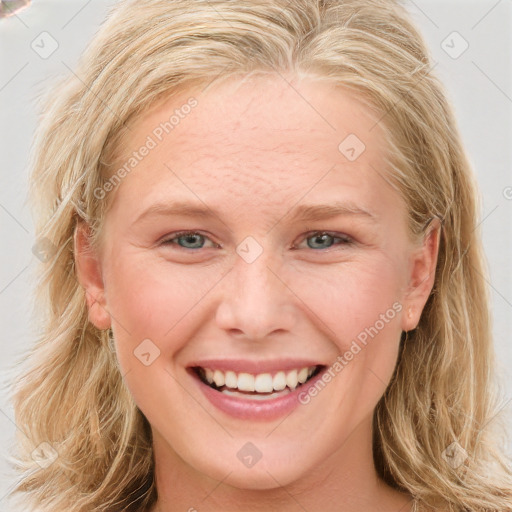 Joyful white young-adult female with long  brown hair and blue eyes