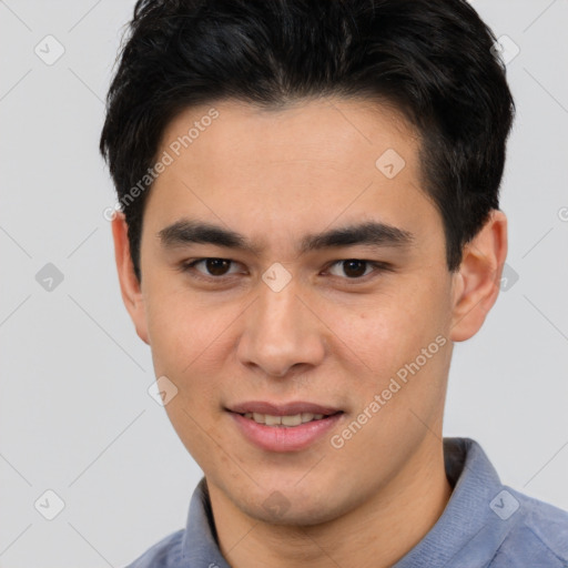 Joyful asian young-adult male with short  brown hair and brown eyes