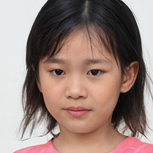 Joyful asian child female with medium  brown hair and brown eyes