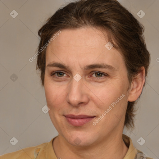 Joyful white adult female with medium  brown hair and brown eyes